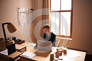 Investing time and hard work into my business. A cropped shot of an attractive young woman working from a home office.