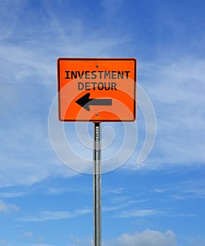 Investment Detour construction sign with arrow and blue sky -- retirement and investing concept