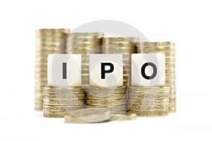 IPO (Initial Public Offering) on gold coins on whi photo