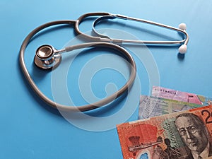 investment in health care, Australian money and stethoscope for medical check