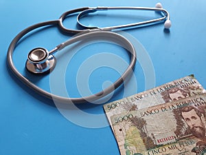 investment in health care, Colombian money and stethoscope for medical check