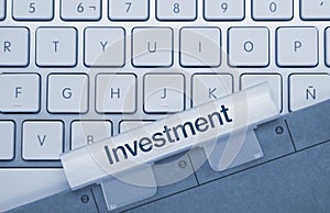 Investment - Inscription on Blue Keyboard Key photo