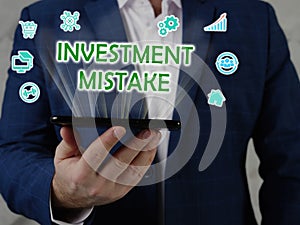 INVESTMENT MISTAKE text in search bar. Merchant looking for something at laptop. INVESTMENT MISTAKE concept