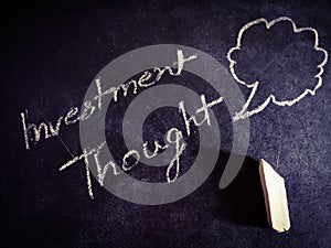 investment thoughts symbol presented on chalkboard concept