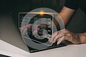 Investor analysis with stock graph on screen