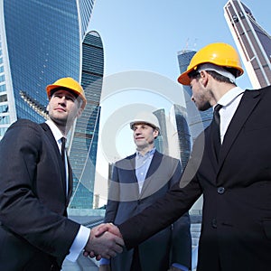 Investor and contractor shaking hands