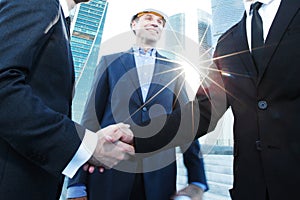 Investor and contractor shaking hands