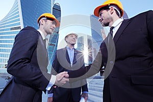 Investor and contractor shaking hands