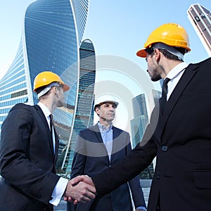 Investor and contractor shaking hands