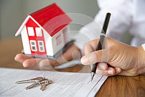 Investors signed a contract,  Buying and selling real estate. Property investment and house mortgage financial concept