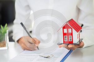 Investors signed a contract,  Buying and selling real estate. Property investment and house mortgage financial concept