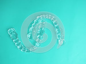 Invisible dental aligners modern tooth brackets, transparent braces to straighten teeth in cosmetic dentistry and orthodontics on