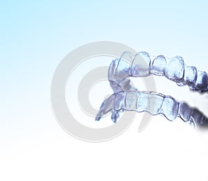 Invisible dental orthodontics held by a woman photo