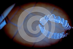 Invisible teeth aligner on light background