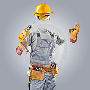 Invisible worker in helmet with drill