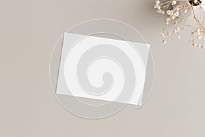 Invitation white card mockup with gypsophila. 5x7 ratio, similar to A6, A5