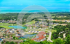 Inviting aerial view on  Blue Mountain village hotel grounds in Georgian Bay,lake Huron, background