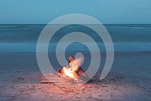 campfire on the beach during the summer, bring back fond memories photo