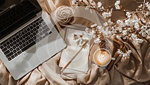 Aesthetic Home Office Setup with Laptop, Coffee, and Spring Blossoms