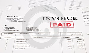 Invoice and bills with paid stamp