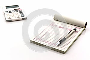 Invoice book which open blank page with pen and calculator.