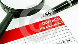 Invoice business document close up with pen background