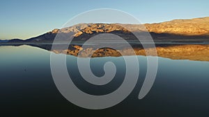 Inyo Mountains Range Reflections on Owens Lake California Sunset Aerial Shot Forward