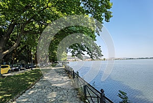 Ioannina  city beside the lake pamvotis, in summer season, platanus trees lake boats , greece