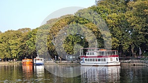 ioannina or giannena in autumn sesaon lake trees boats colors blue sky greece