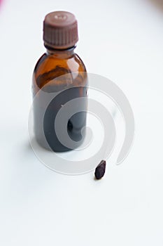 Iodine jar and ear stick on the windowsill. Medicine for dermatic diseases, contagious mollusks. Bank with medicines