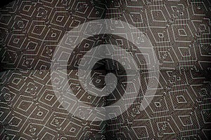 Ion Fabric texture, futuristic textile background in brown color photo