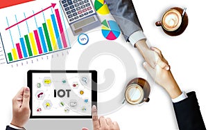 IOT business man hand working and internet of things (IoT) word