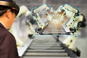 Iot industry 4.0 concept,industrial engineerblurred using smart glasses with augmented mixed with virtual reality technology to