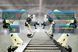 Iot industry 4.0 concept.Smart factory using automation robotic arms with augmented mixed virtual reality technology to show data