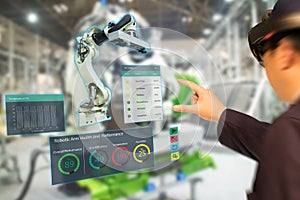 Iot industry 4.0 concept,industrial engineerblurred using smart glasses with augmented mixed with virtual reality technology to