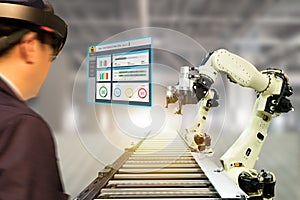 Iot industry 4.0 concept,industrial engineerblurred using smart glasses with augmented mixed with virtual reality technology to