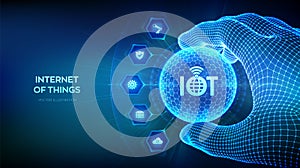 IOT. Internet of things logo in the shape of sphere with hexagon pattern in wireframe hand. Everything connectivity device concept