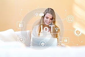 IoT security theme with young woman using her laptop