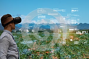 Iot smart industry robot 4.0 agriculture concept,agronomist,smart farmer using smart glasses augmented mixed virtual reality,arti