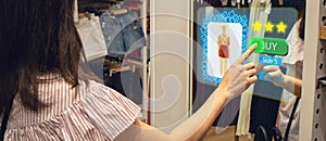 Iot smart retail futuristic technology concept, happy girl try to use smart display with virtual or augmented reality in the shop