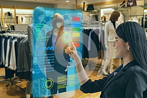 Iot smart retail futuristic technology concept, happy girl try to use smart display with virtual or augmented reality  in the shop