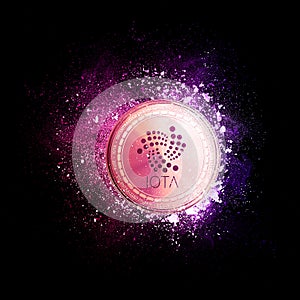 IOTA coin flying in violet particles.