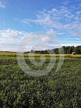 Iowa Farmland with Rolled Bailed Hay