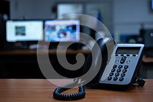 IP telephone on wood table, office workspace