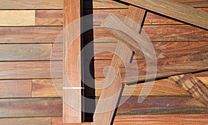 Ipe decking installation with wood slats photo