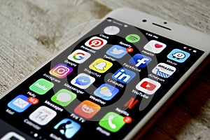 iPhone with assortment of apps displayed