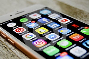 iPhone with assortment of apps displayed