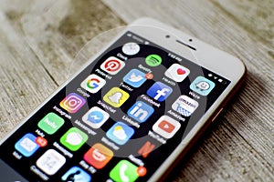 iPhone with assortment of apps displayed