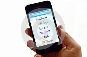 Apple Iphone 4S on the right hand isolated