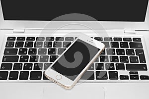 IPhone 5s Gold on silver laptop